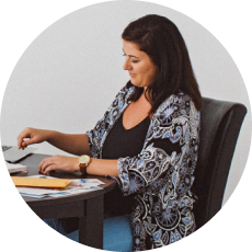 Woman choosing furniture rental package while seated.