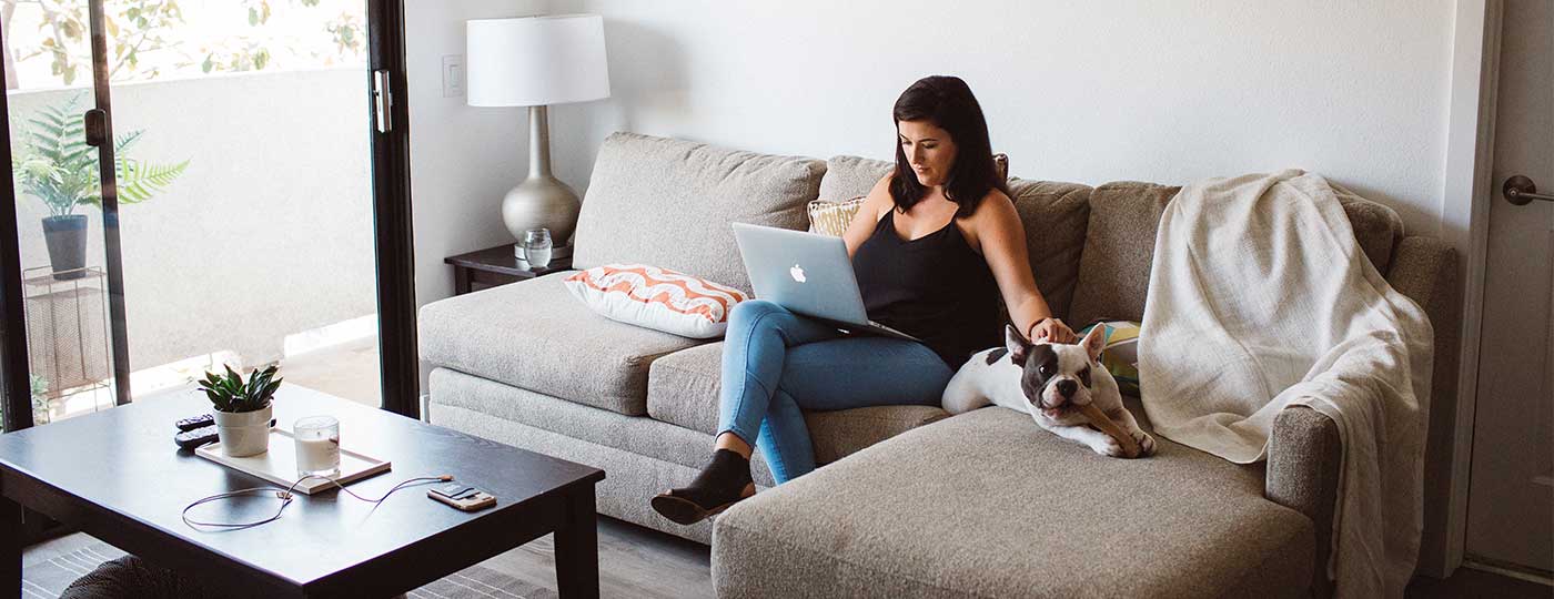 Entrepreneur working from home on furniture she rented from CORT