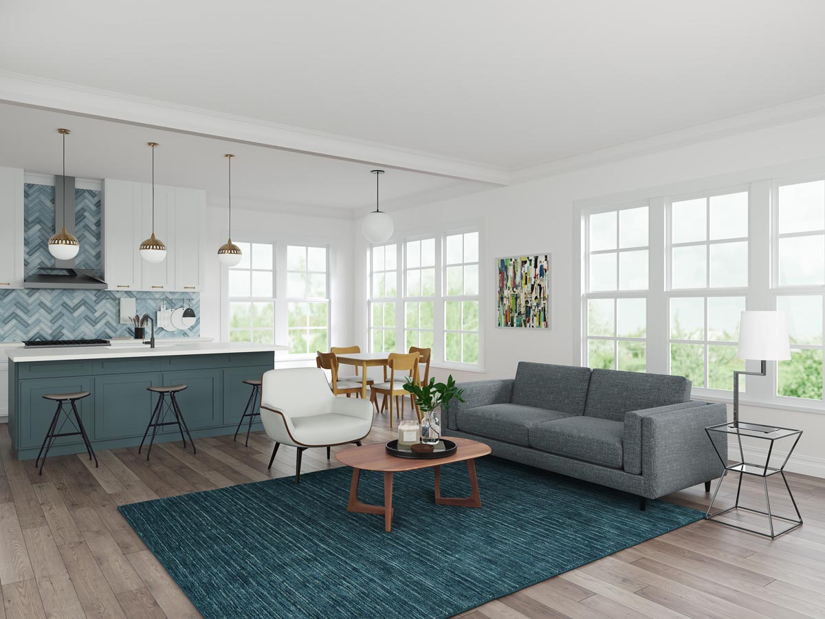 Open-concept living room with grey Mitchell sofa and kitchen in background