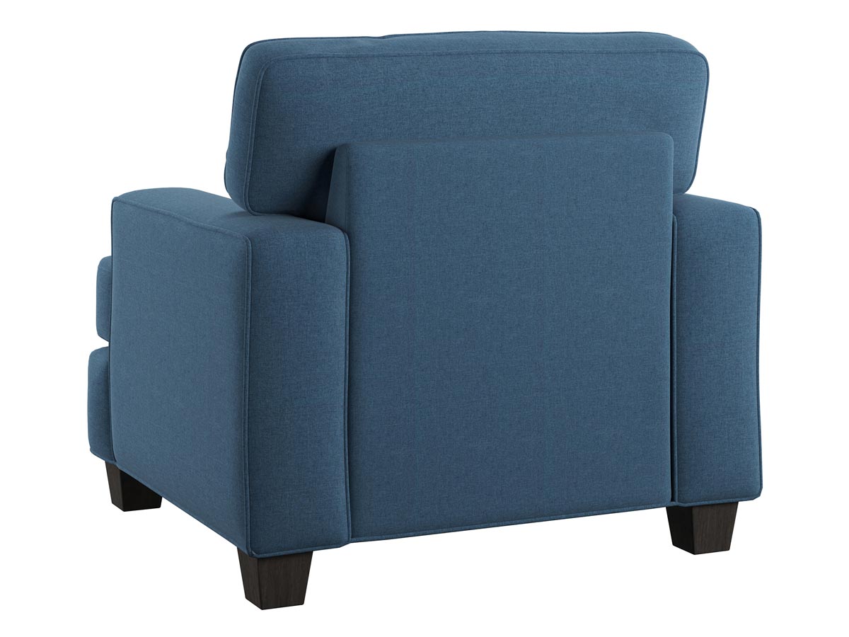 Rear view of blue upholstered armchair showing back and sides