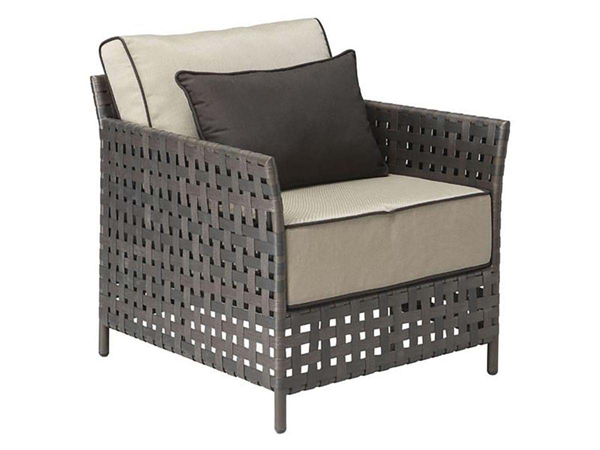 Side view of Pinery Arm Chair with beige cushions and dark pillow